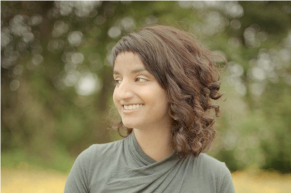 Woman in field smiling