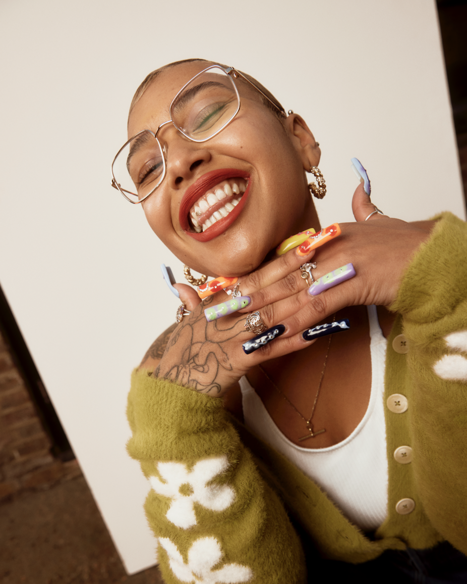 Artist Jazmin Morris smiling with eyes closed.